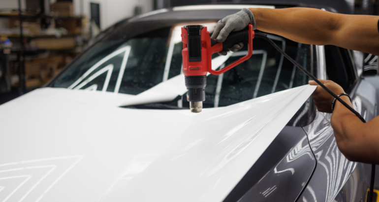 Artcal - Person Installing Wrapping Onto Car - Car Wraps Blog